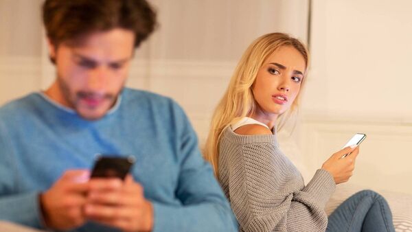 Wife Catching Cheating Husband Texting With Another Woman At Home